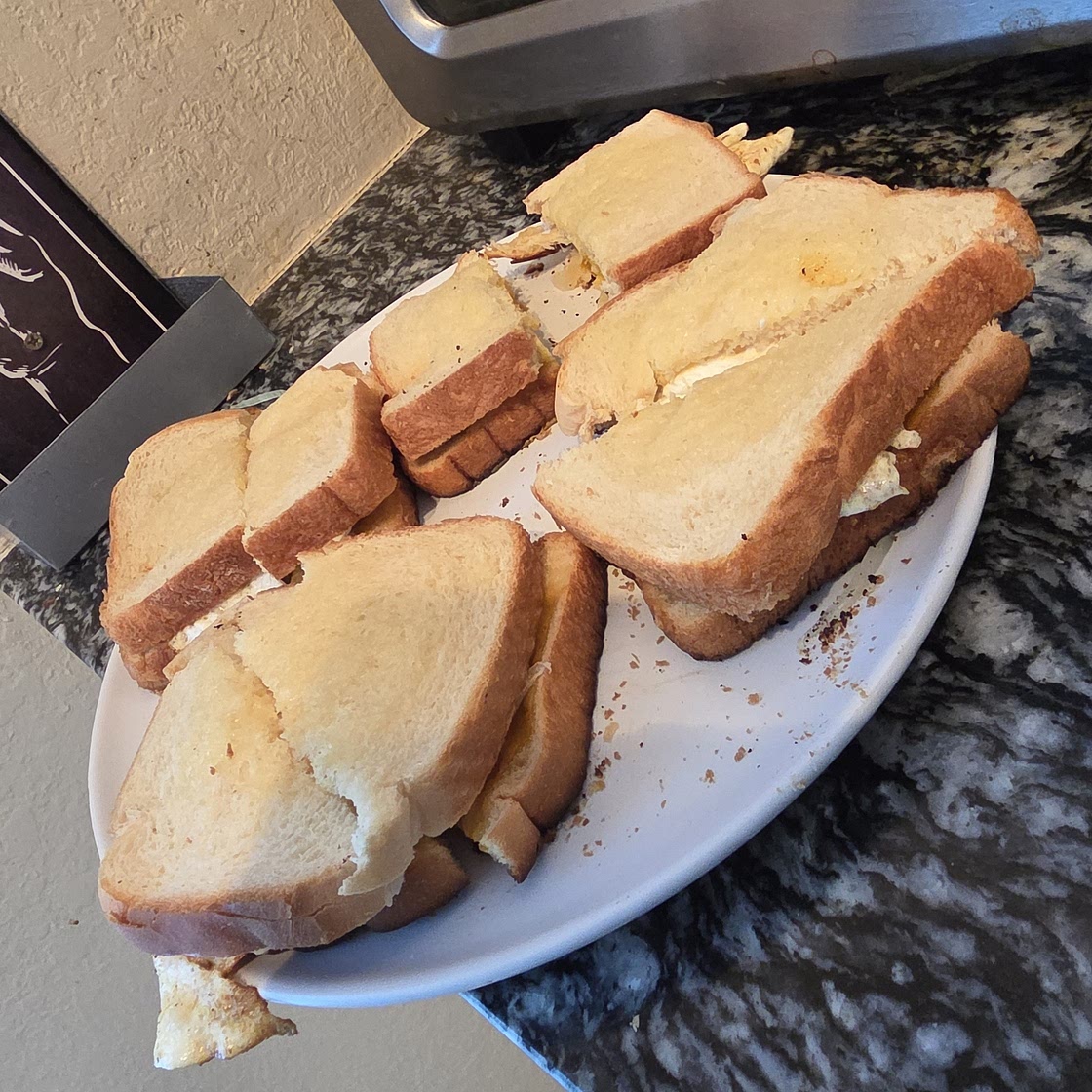 Warm sandwich with cheese egg and avocado 