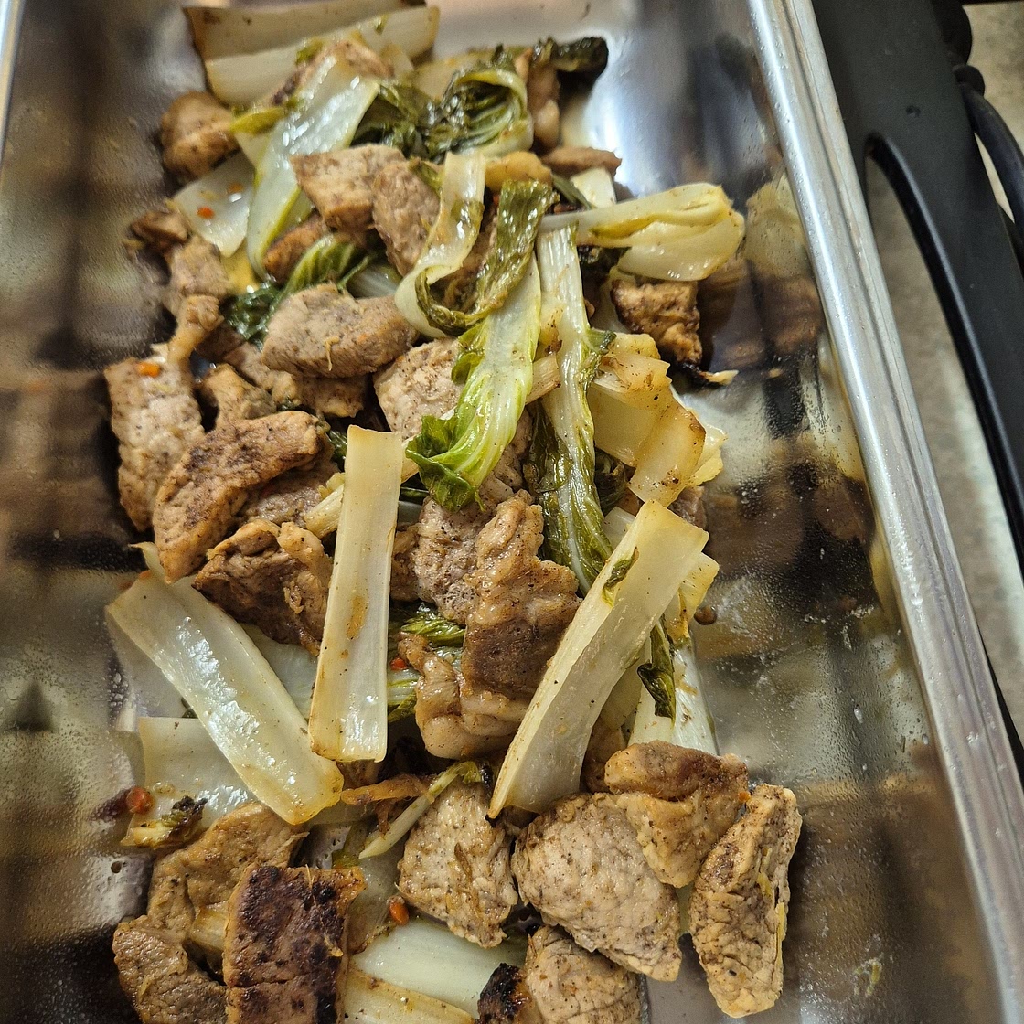 Spicy ginger and garlic pork with pak choi