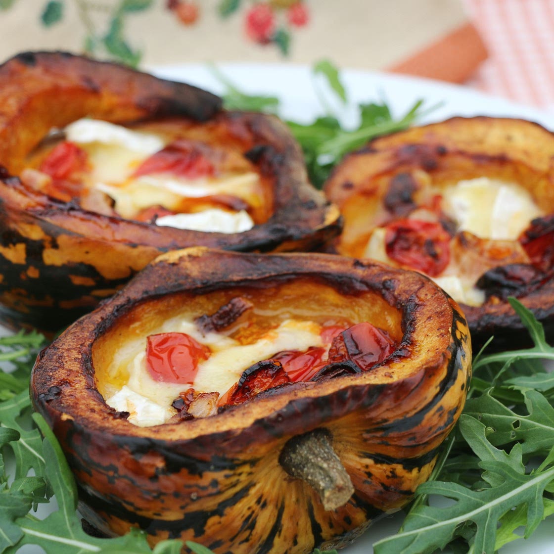 Baked winter squash with tomato, onion and camembert
