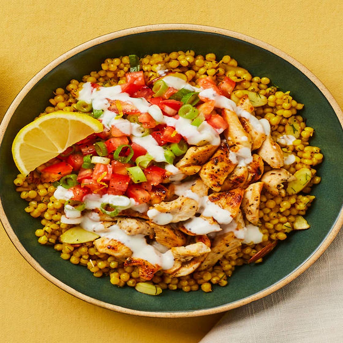 Lemon Dill Chicken & Couscous Bowls with Tomato Salad, Garlicky Yogurt Sauce & Almonds