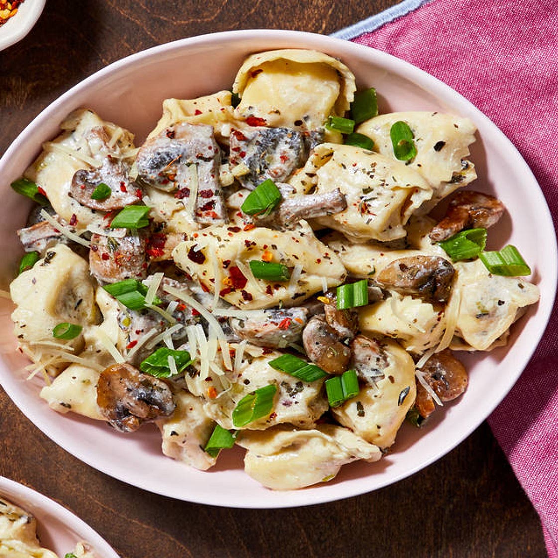 Cheese Tortelloni with Mushroom Sauce, Parmesan, and Chili Flakes
