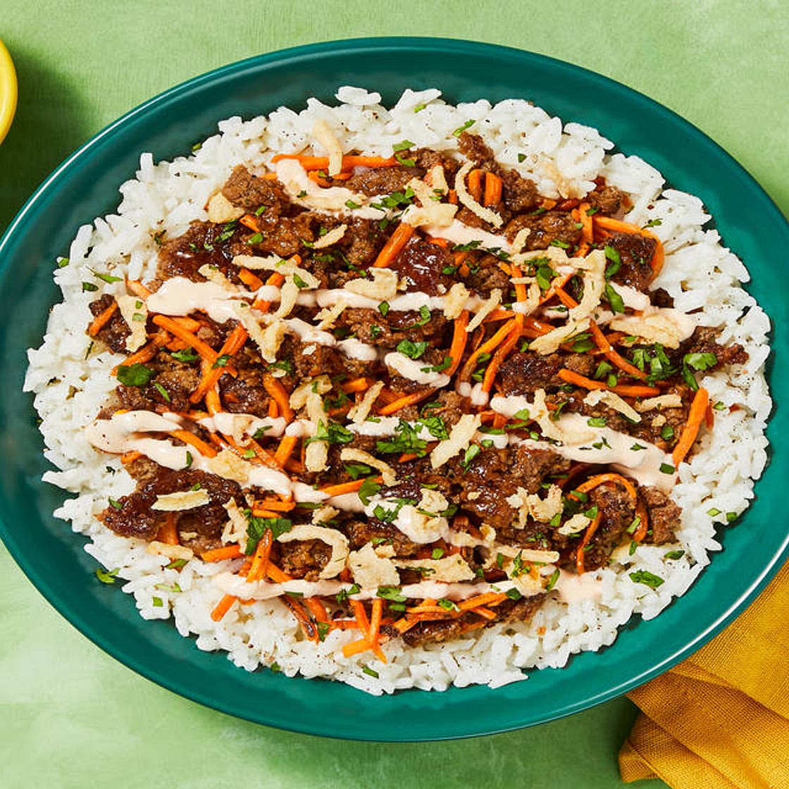 Sesame-Soy Beef Bowls with Jasmine Rice, Sriracha Mayo, Cilantro & Crispy Fried Onions