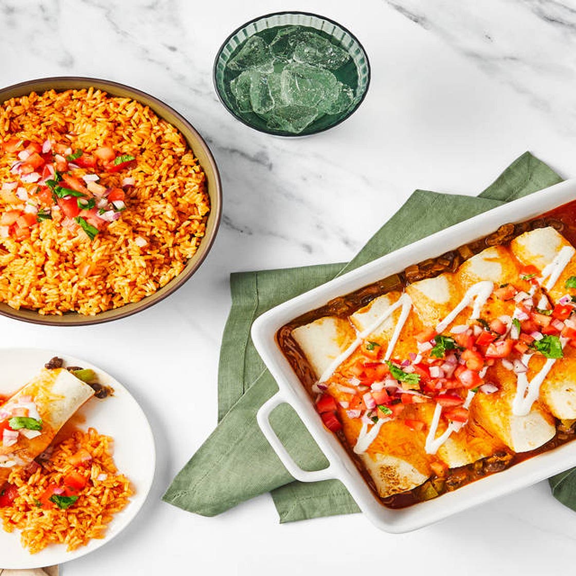 David Burtka’s Cheesy Chicken & Bean Enchiladas with Tomato Rice, Pico de Gallo & Lime Crema