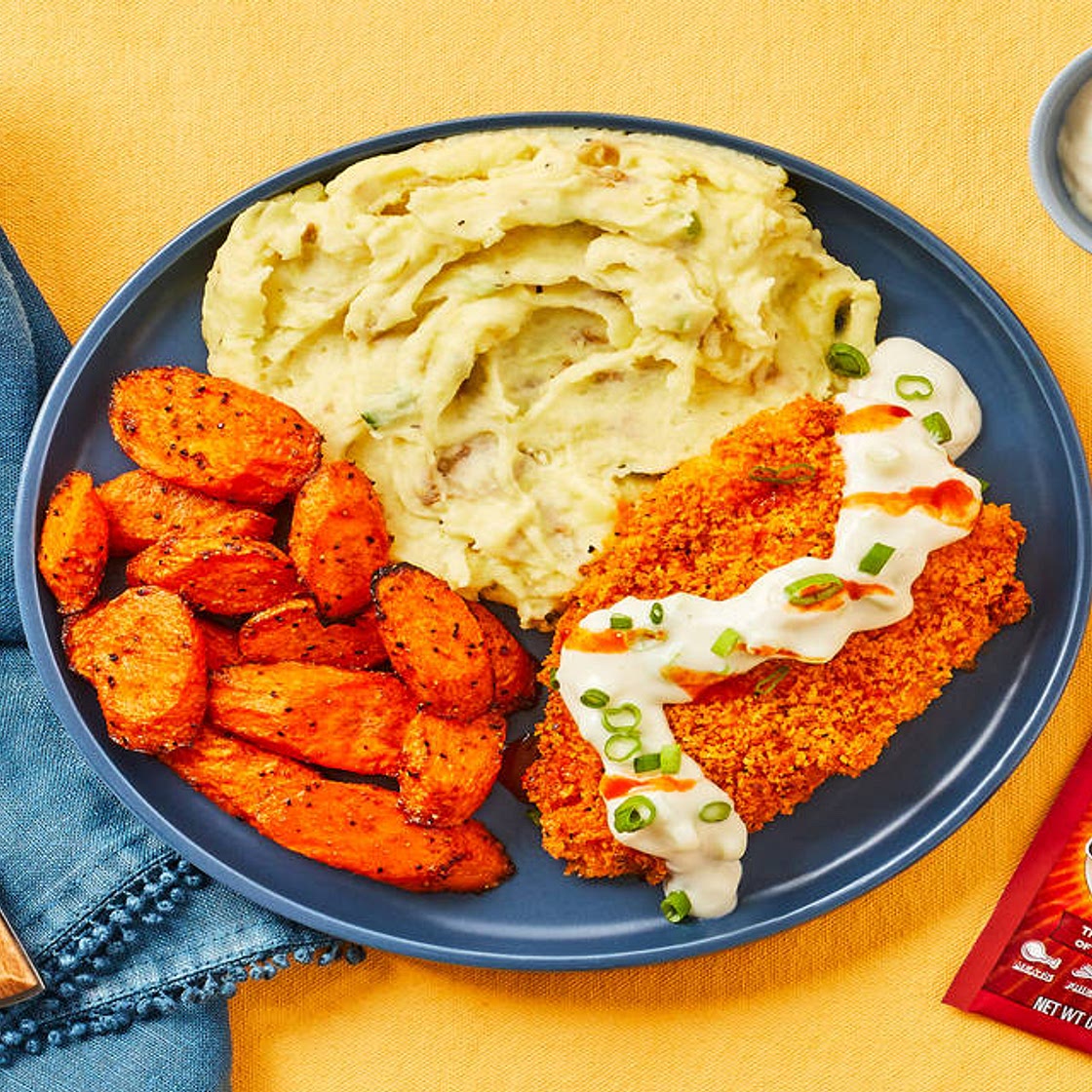 Crispy Frank’s RedHot®-Spiced Chicken with Blue Cheese Sauce, Scallion Mashed Potatoes & Carrots