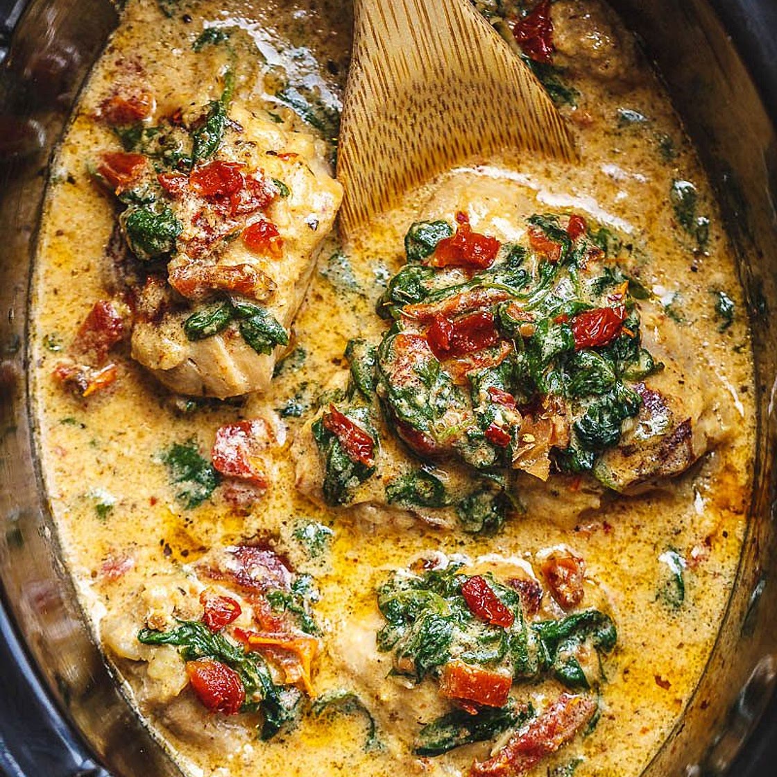 CrockPot Tuscan Garlic Chicken Thighs With Spinach and Sun-Dried Tomatoes