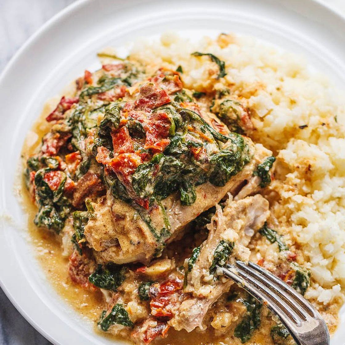 CrockPot Tuscan Garlic Chicken Thighs With Spinach and Sun-Dried Tomatoes