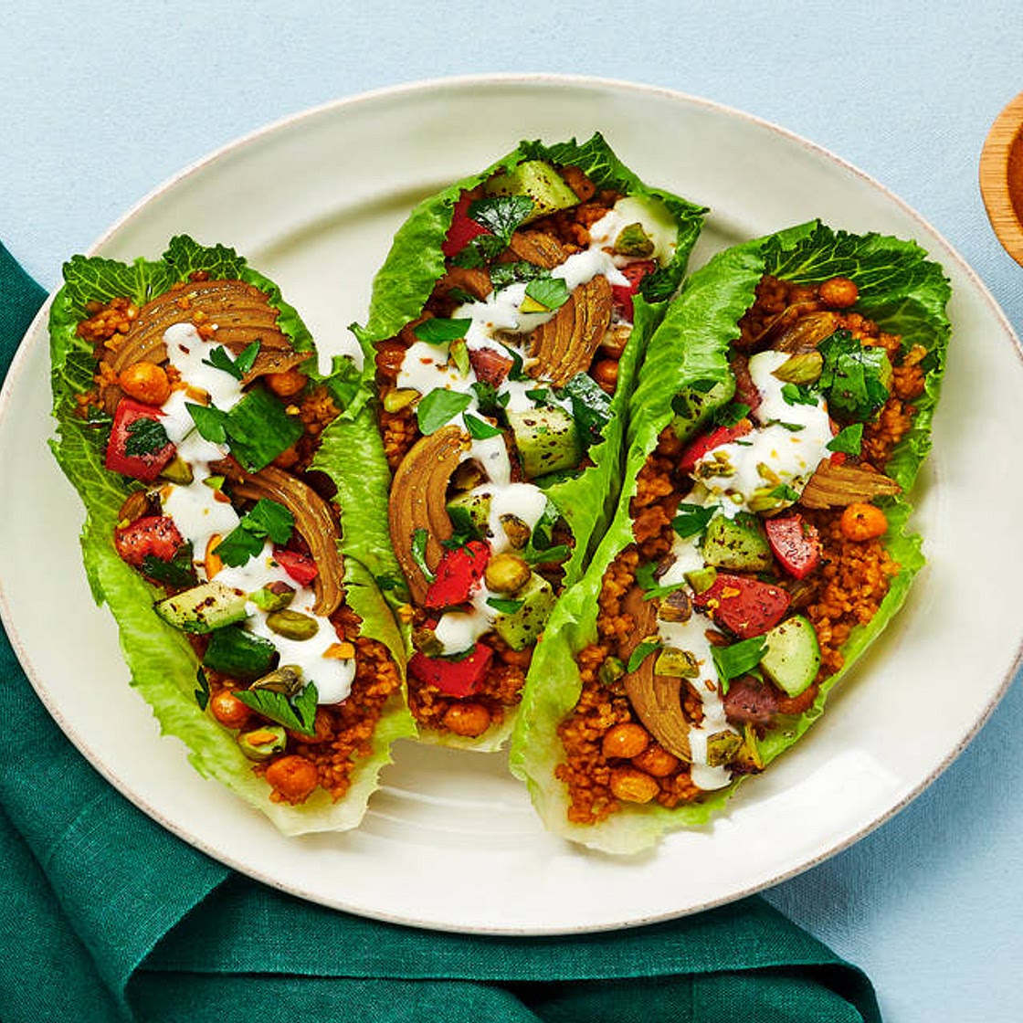 Shawarma Chickpea Lettuce Wraps with Israeli Salad, Pistachios & Lemon Garlic Yogurt Sauce