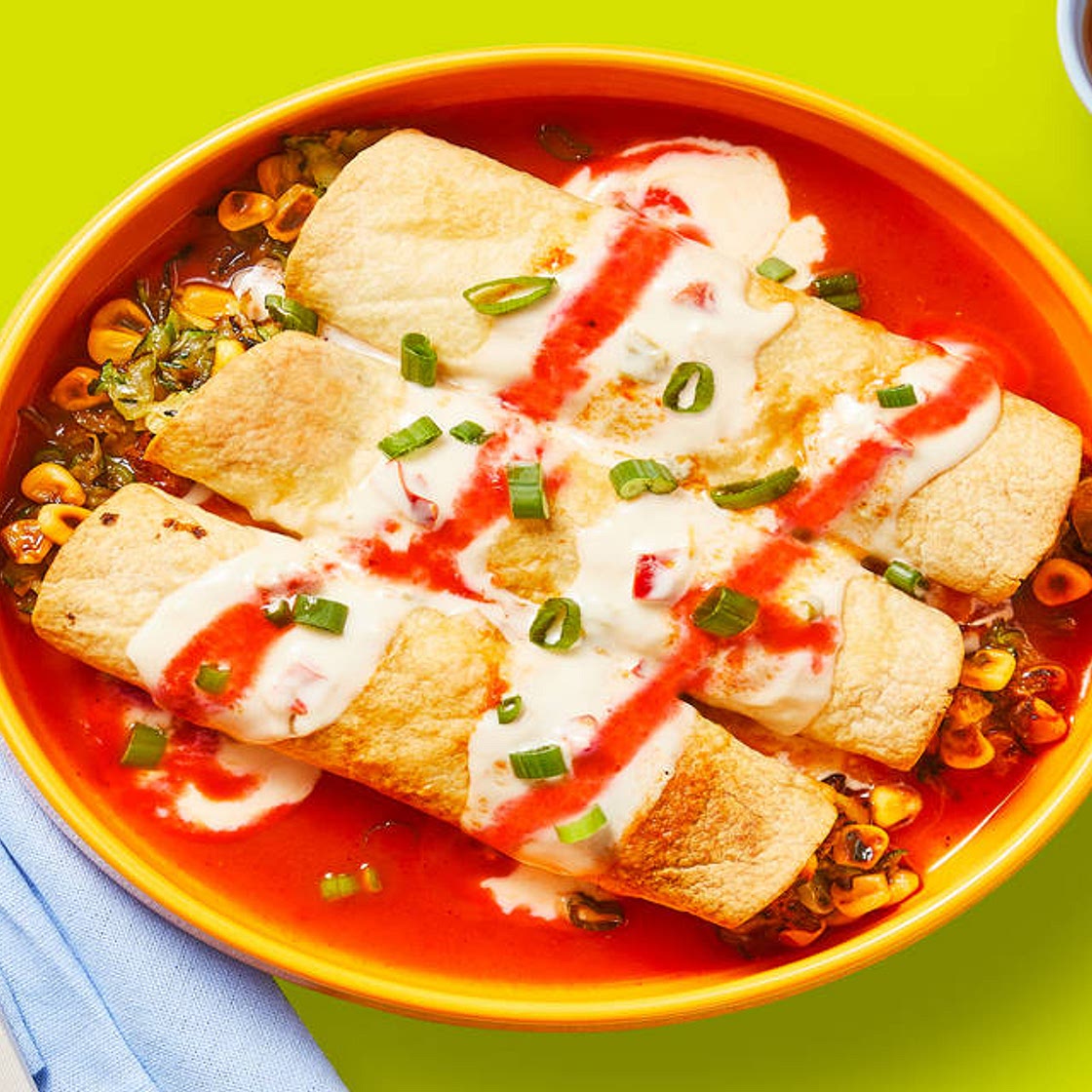 Southwest Corn & Zucchini Flautas with Enchilada Sauce & Queso Blanco