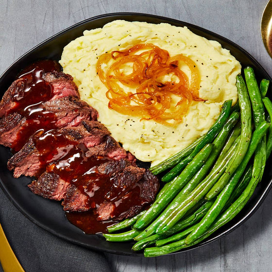 Bavette Steak in a Demi Glace Sauce with Caramelized Onion Mashed Potatoes & Roasted Green Beans