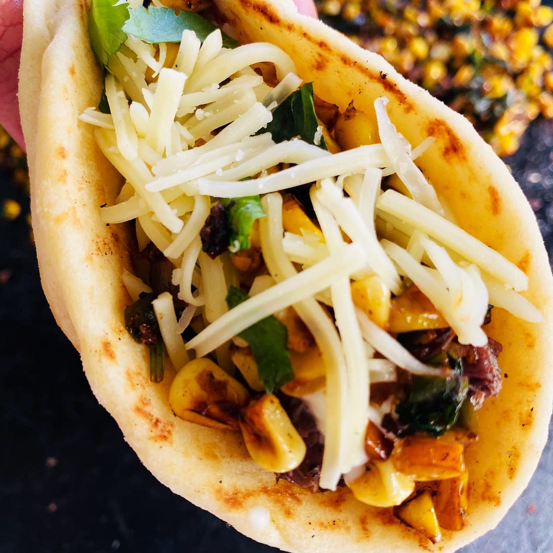 Blackstone Steak and Corn Naan Tacos