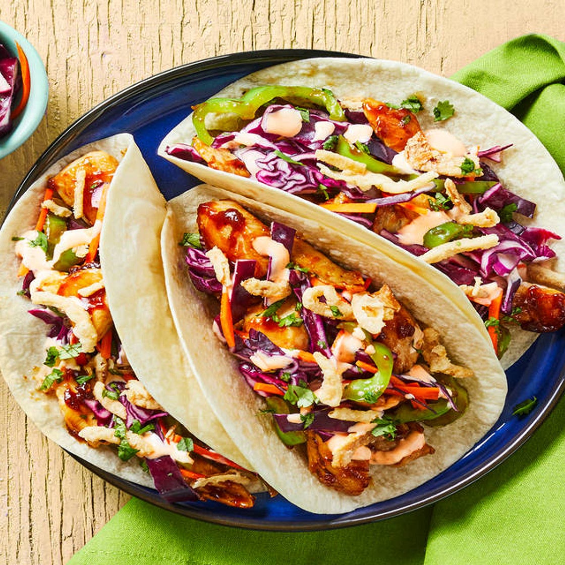 Chicken Stir-Fry Tacos with Tangy Cabbage Slaw, Green Pepper, Sriracha Mayo & Crispy Fried Onions