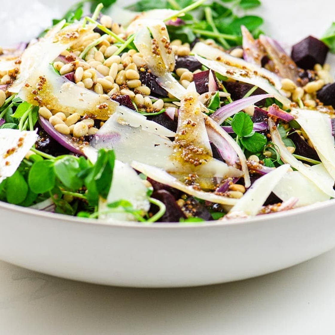 Pea Shoot Salad with Pine Nuts and Manchego