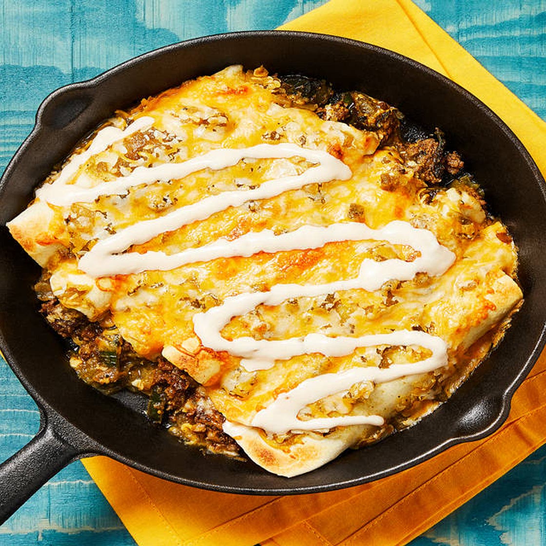 One-Pan Beef Enchiladas Verdes with Mexican Cheese Blend & Hot Sauce Crema