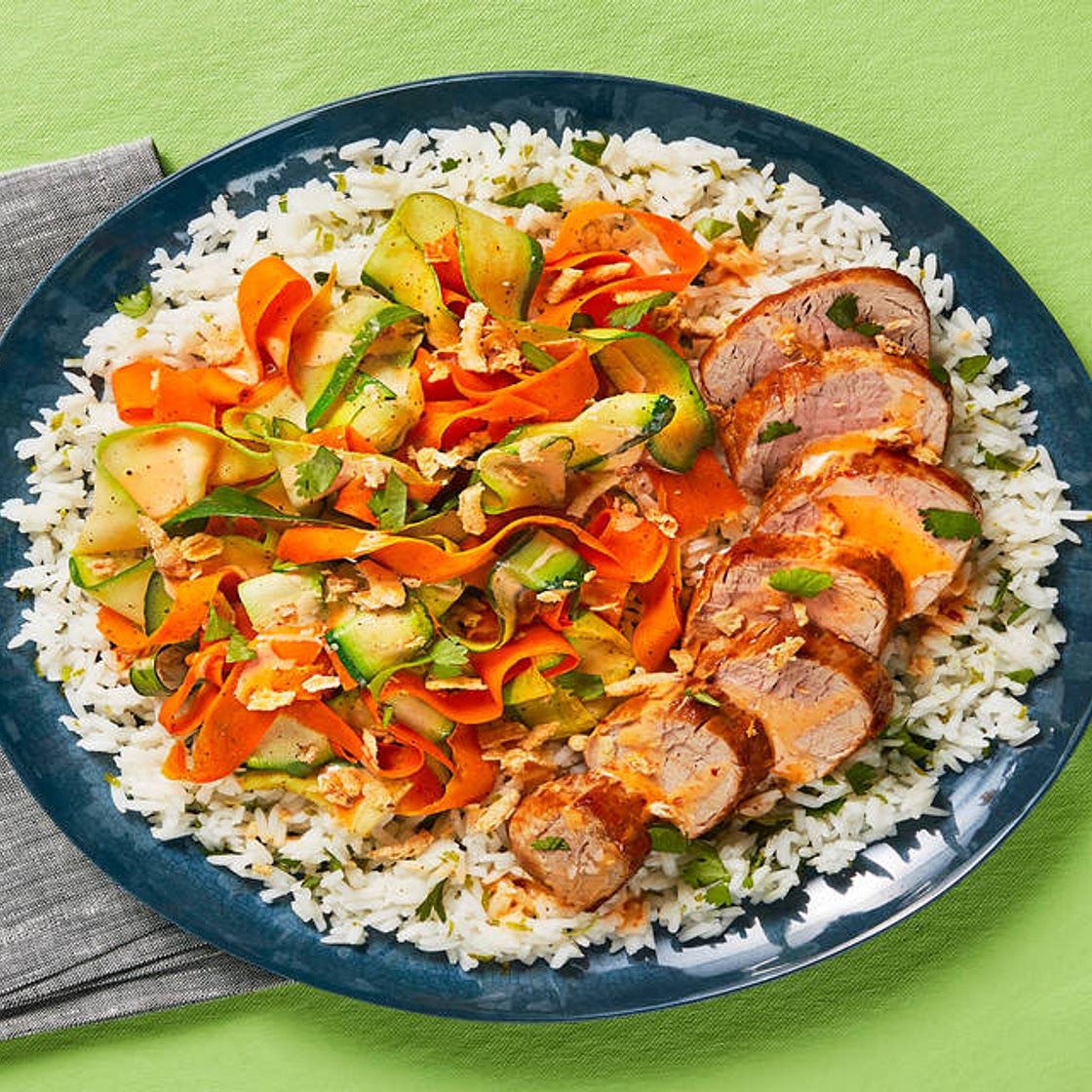 Sweet Chili Pork Tenderloin Rice Bowls with Veggie Ribbons, Cilantro & Crispy Onions