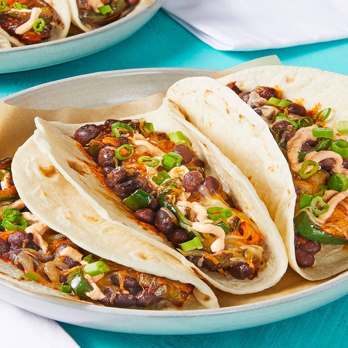 Cheesy Black Bean Tacos with Poblano & Smoky Red Pepper Crema