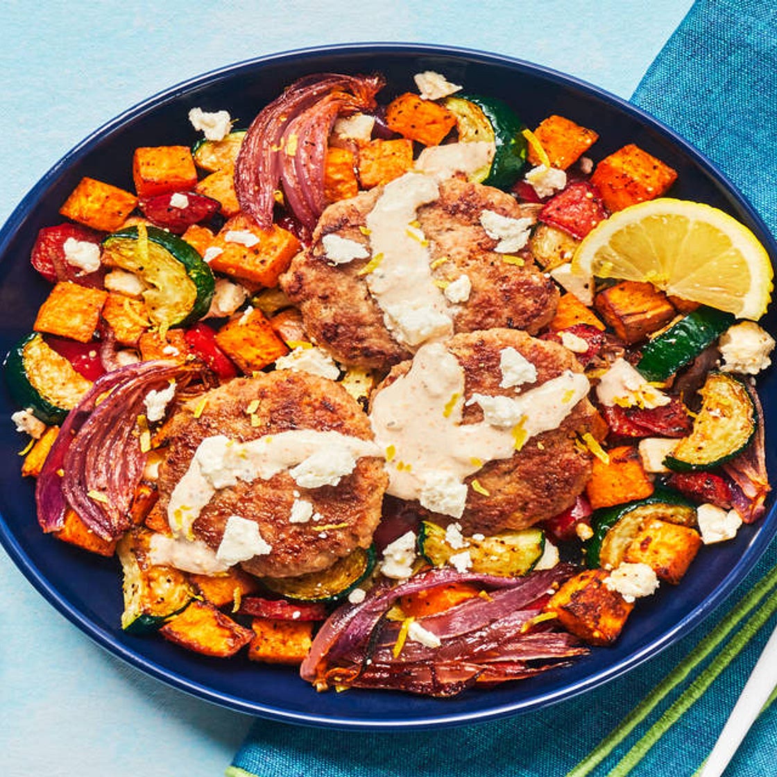 Turkey Patties with Smoky Lemon Crema over a Bed of Roasted Veg