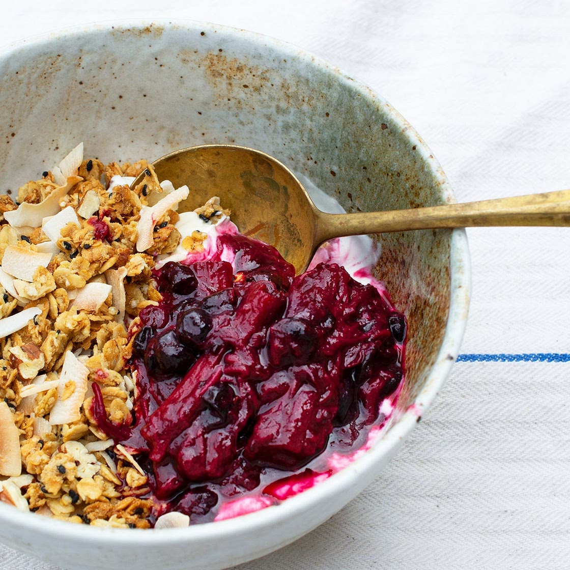Pecan and coconut granola with roasted rhubarb and blackcurrants