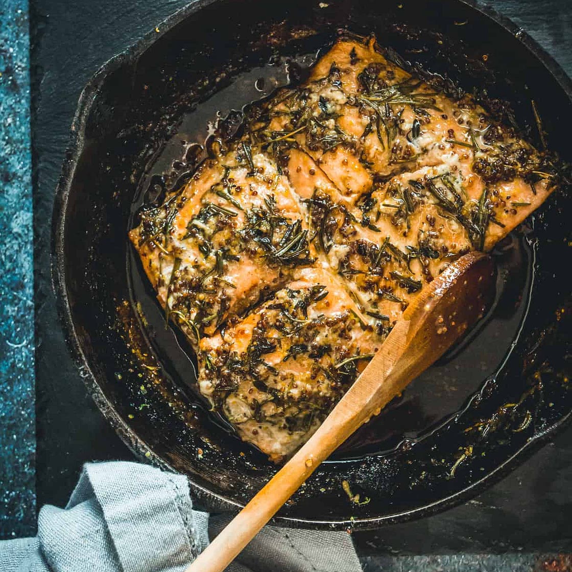 Cast-iron pan fried sockeye salmon with mustard, honey and wild herbs