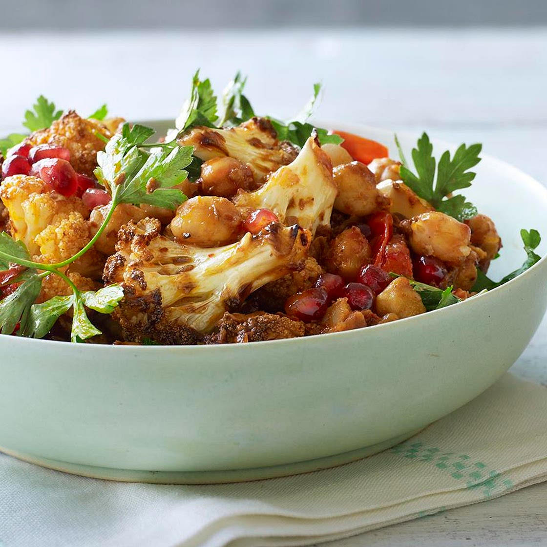 Warm spiced cauliflower and chickpea salad with pomegranate seeds