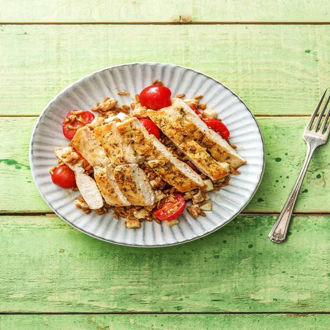 Pan-Seared Chicken with Herbs De Provence Over a Warm Farro, Mozzarella, and Tomato Jumble