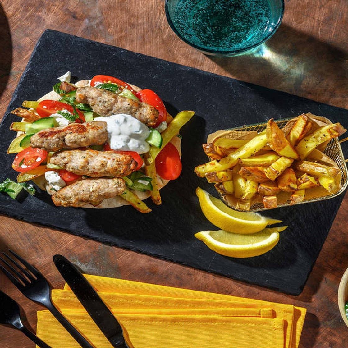 Greek Inspired Oregano Pork Kofta Gyros with Chips, Mint Yoghurt Sauce and Tomato & Cucumber Salad