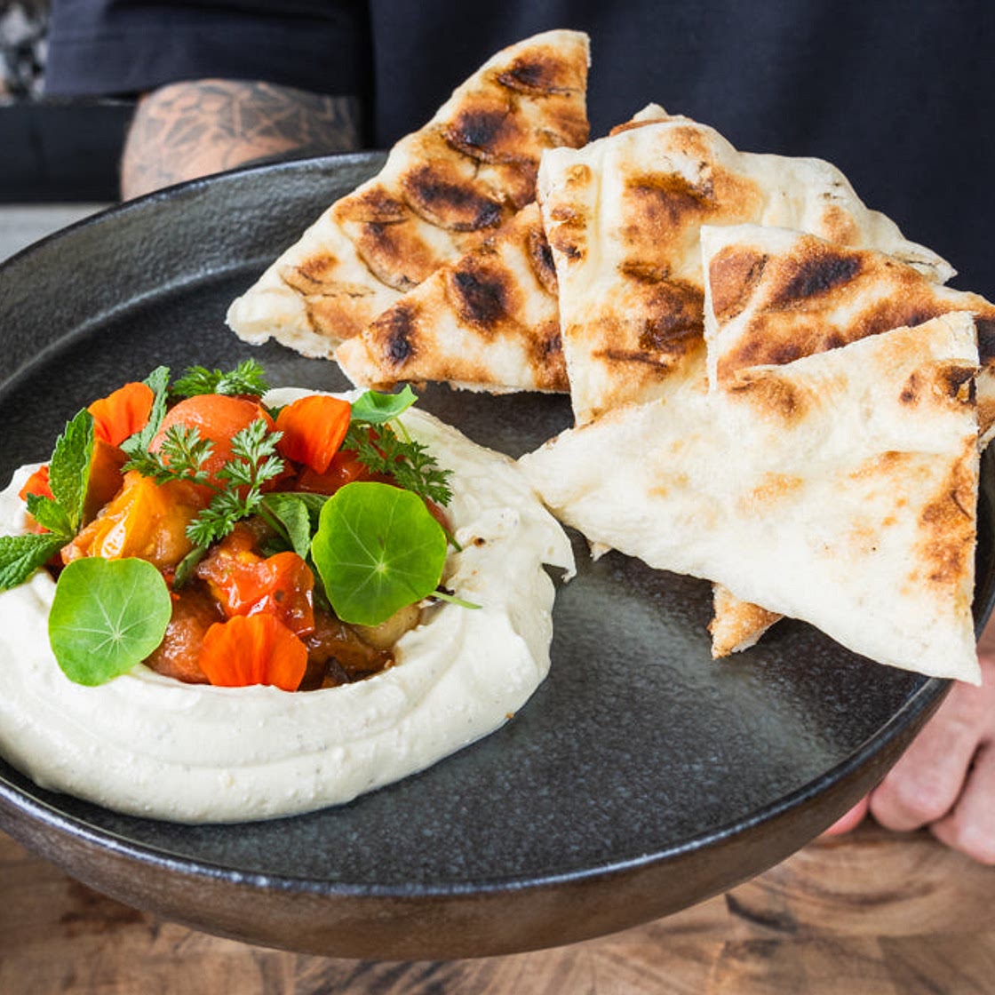 Grilled flatbread, whipped feta and blistered tomatoes