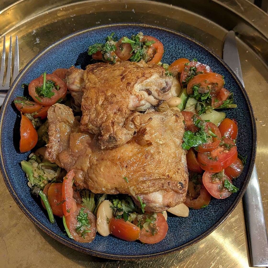 Chicken thighs with butter beans, courgettes, broccoli and a tomato salsa