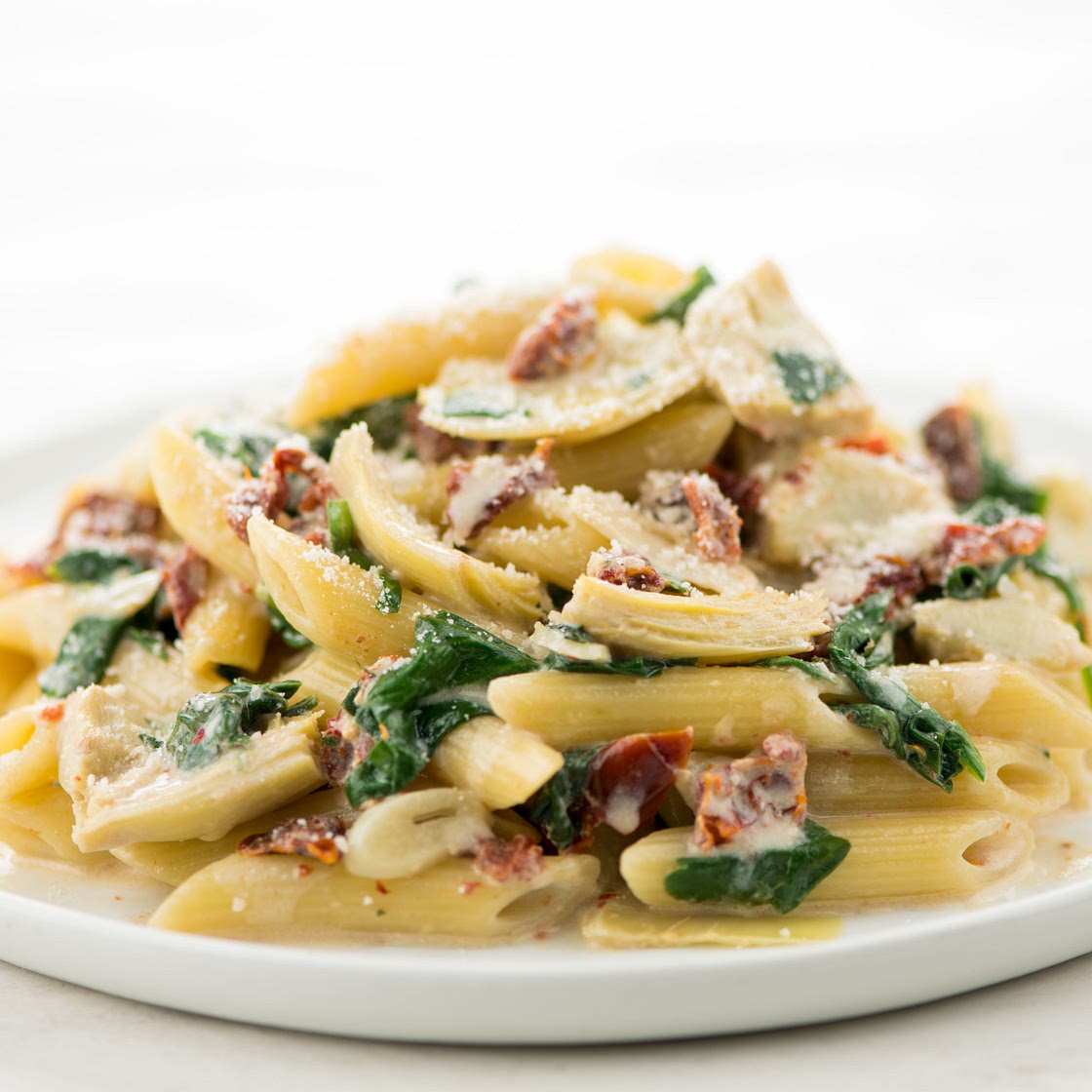 Creamy Spinach & Artichoke Penne Pasta with sun-dried tomatoes