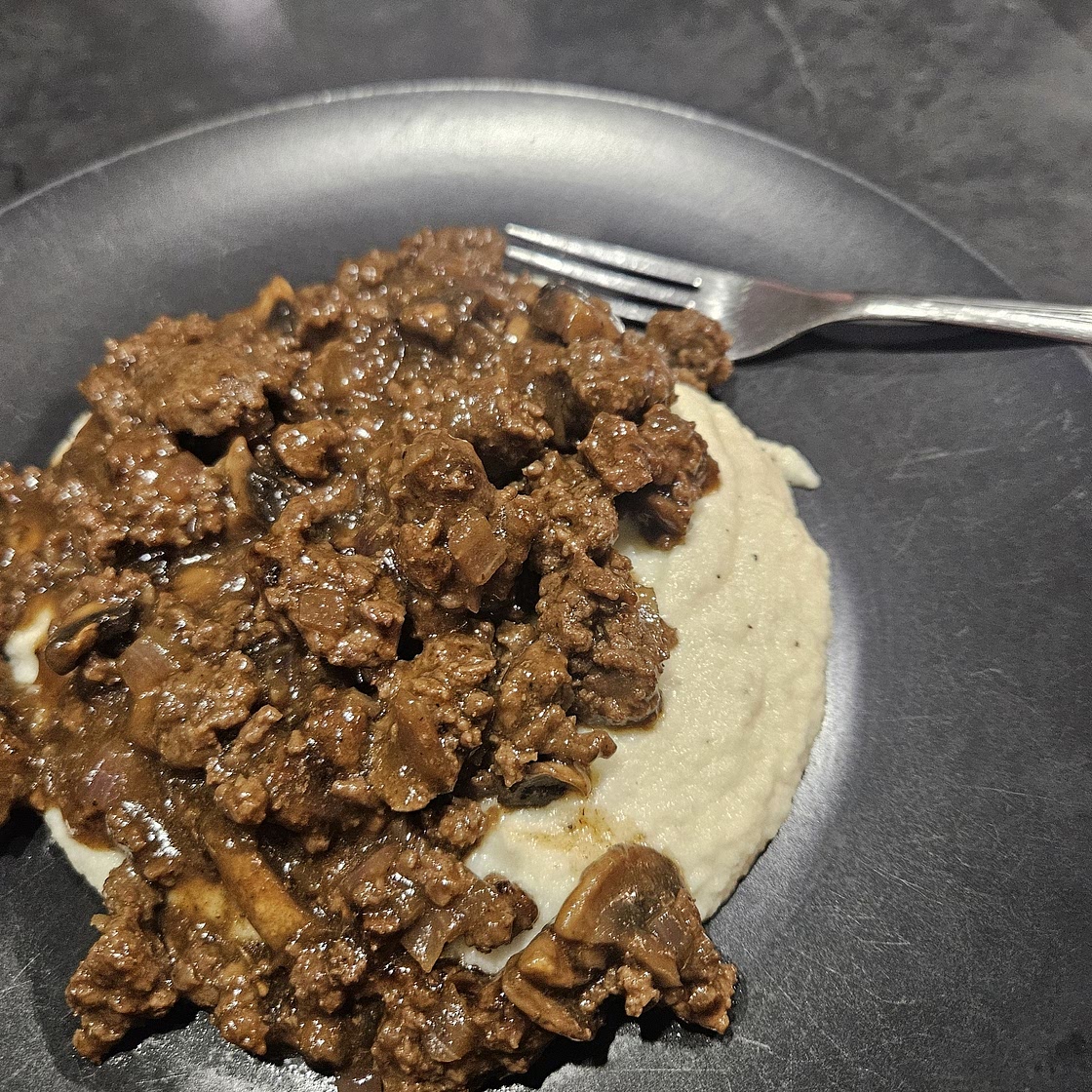 Beef gravy over cauliflower mash