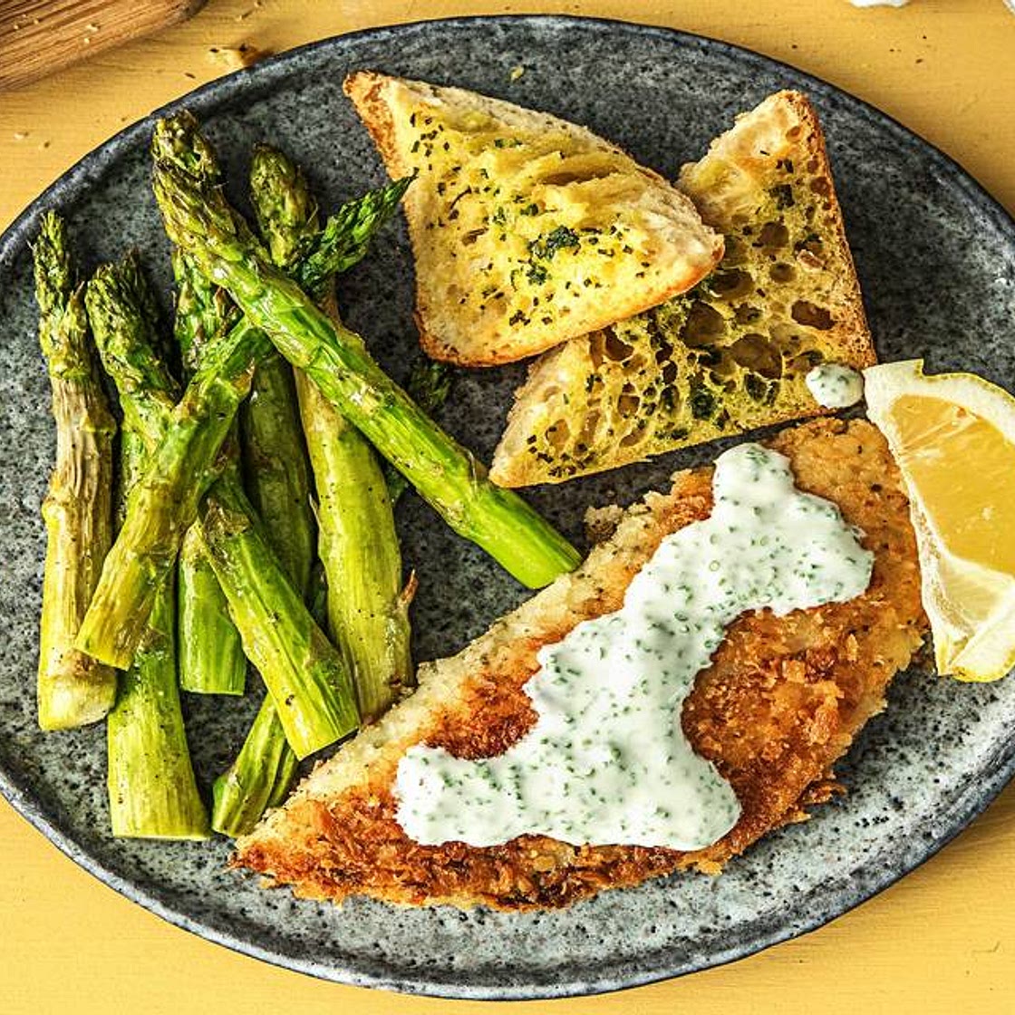 Crispy Breaded Tilapia with Asparagus, Lemon Chive Sauce, and Ciabatta Toasts