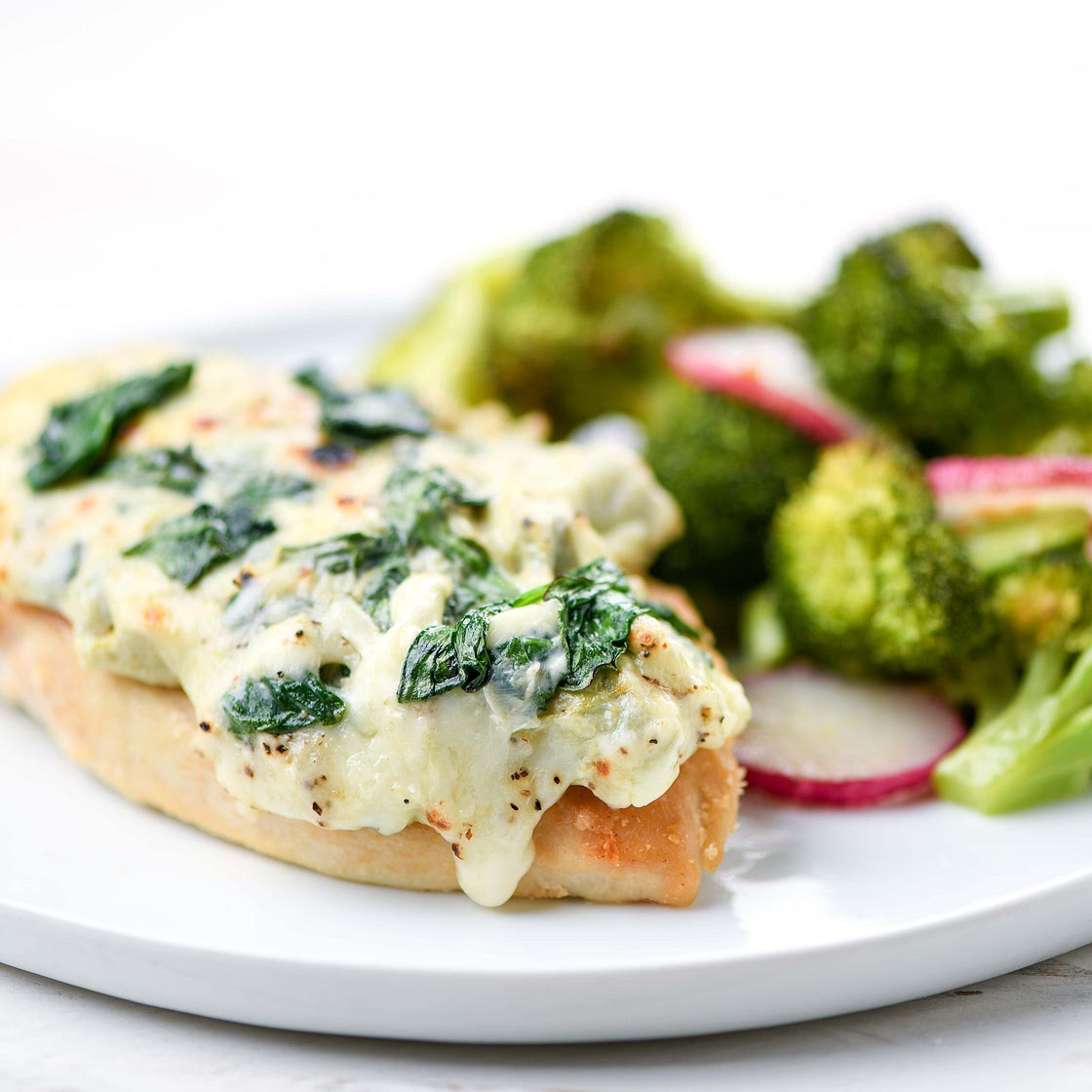 Spinach-Artichoke Chicken with roasted broccoli and radishes