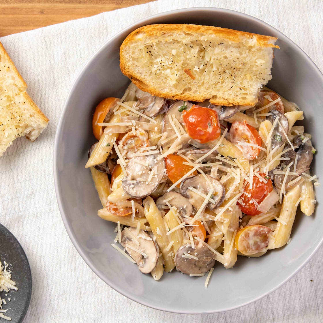 Mushroom Parmesan Penne Pasta with oregano and baguette