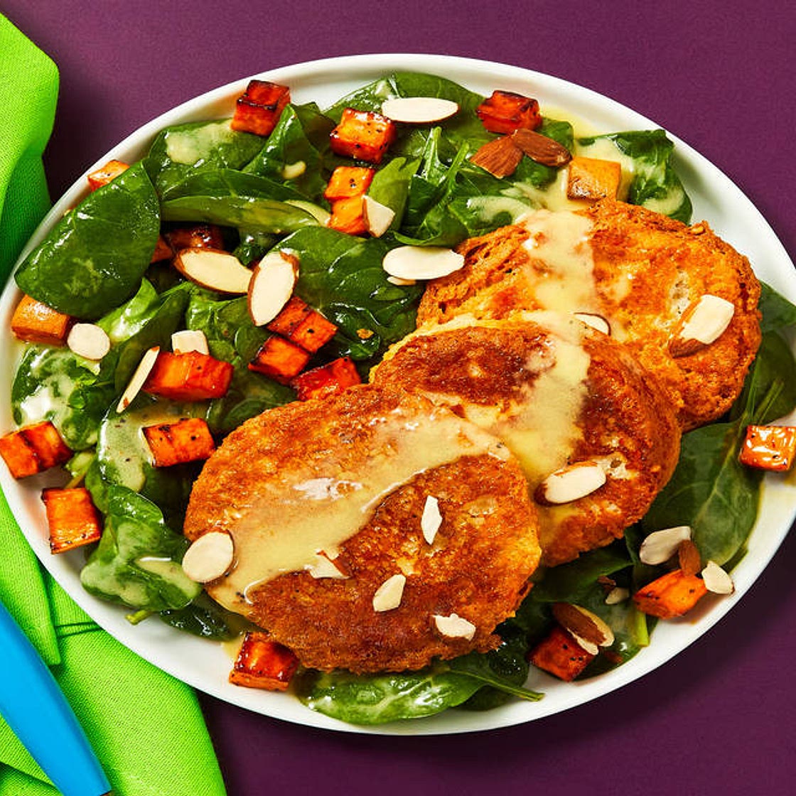 Savory Ricotta Fritters over a Spinach & Roasted Sweet Potato Salad