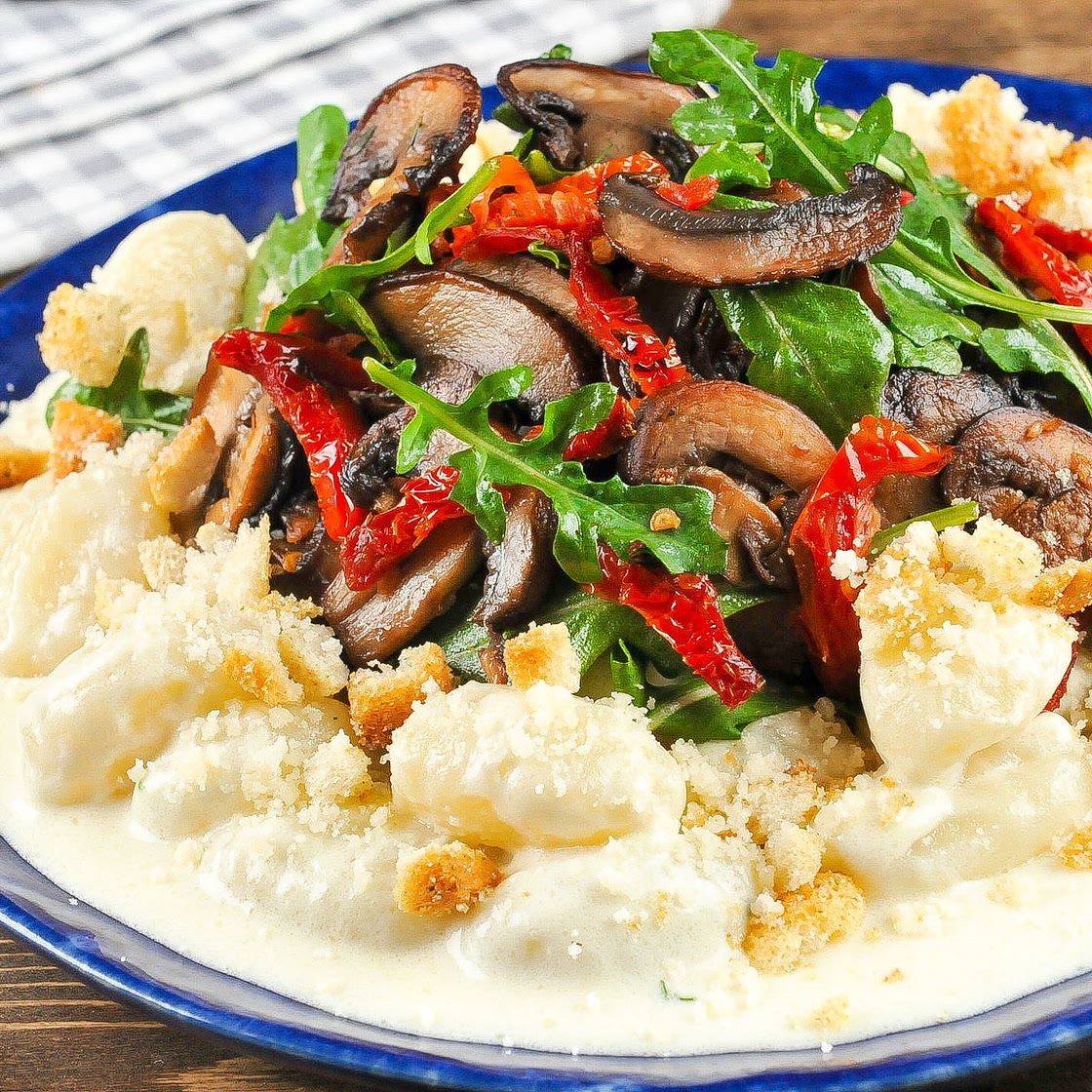 Gnocchi in Truffled Parmesan Cream with cremini mushrooms and sun-dried tomatoes