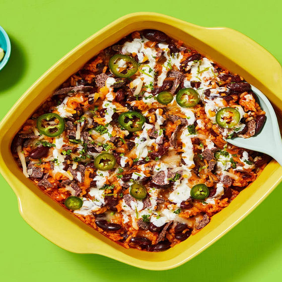 One-Pan Rice & Bean Enchilada Bake with Pickled Jalapeño, Zesty Crema & Blue Corn Tortilla Chips
