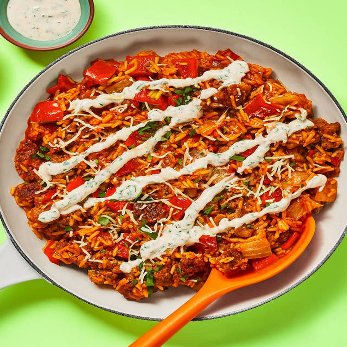 One-Pan Cajun Pork Sausage Skillet with Dirty Rice & Parsley Crema