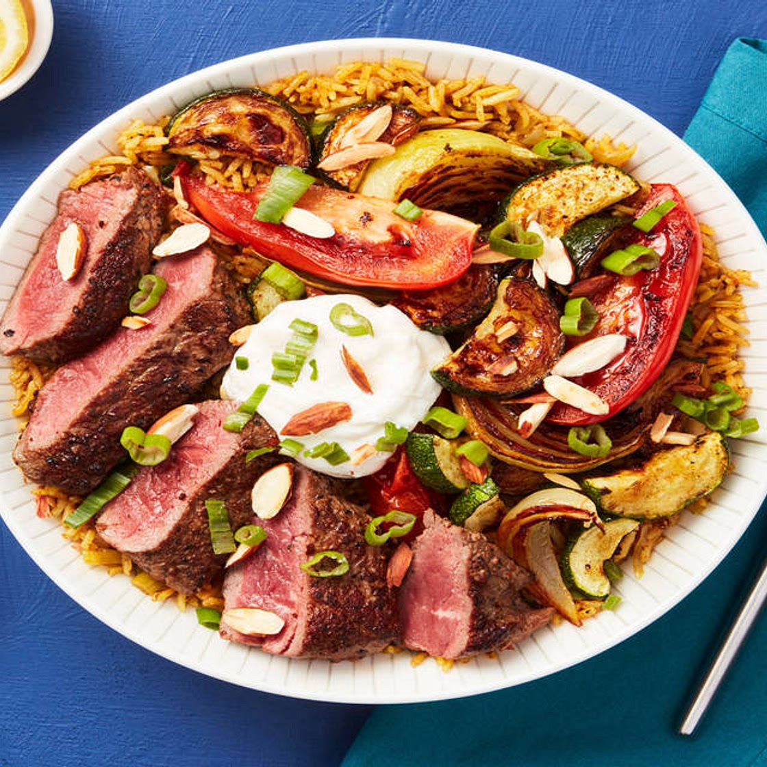 Middle Eastern Steak Bowls with Spiced Basmati Rice, Roasted Veggies & Lemon Garlic Yogurt Sauce