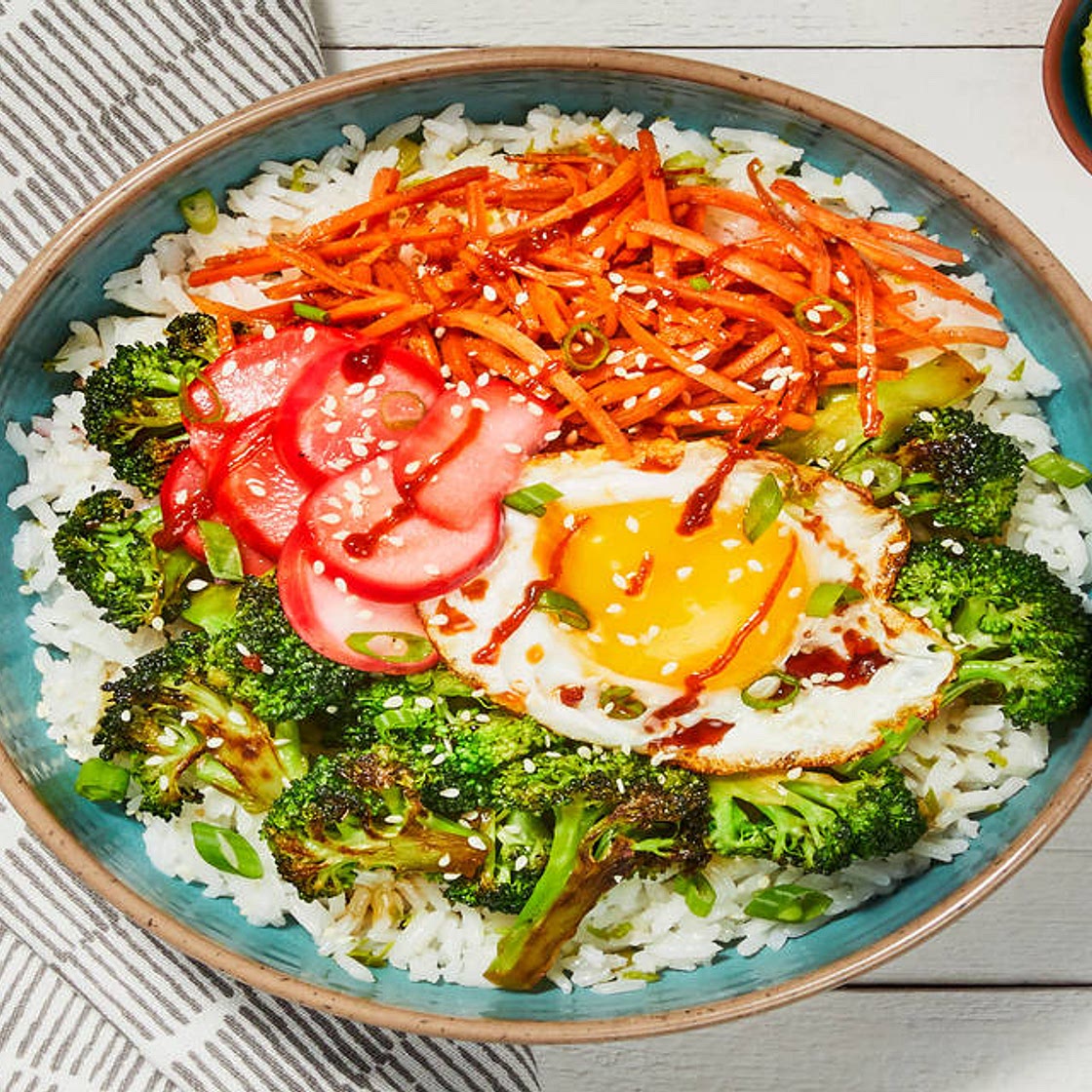 Broccoli-Carrot Donburi with a Fried Egg over Scallion Lime Rice with Pickled Radishes & Sesame Seeds