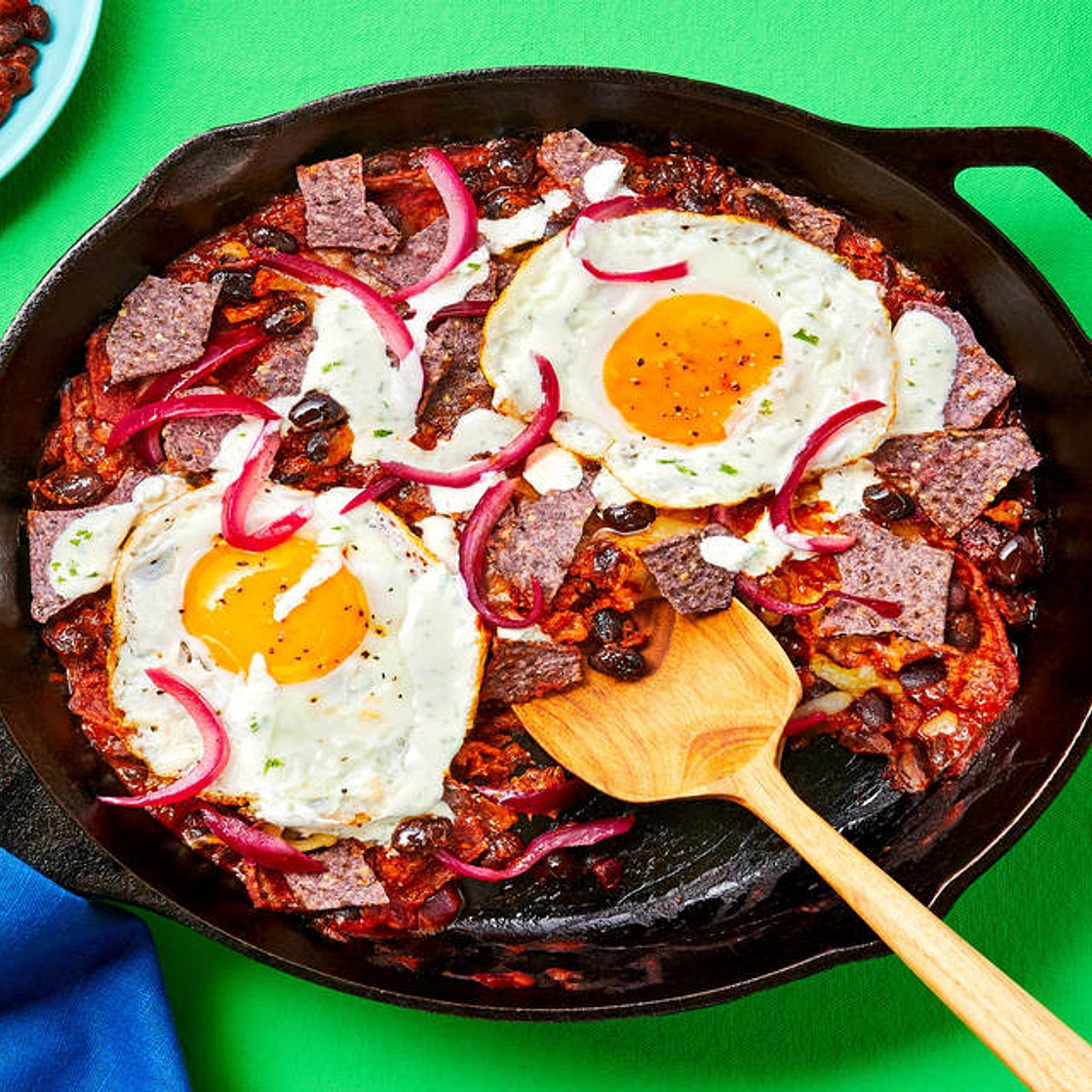 Blue Corn Tortilla Skillet with Eggs, Black Beans, Lime Crema, Pickled Onion & Pepper Jack