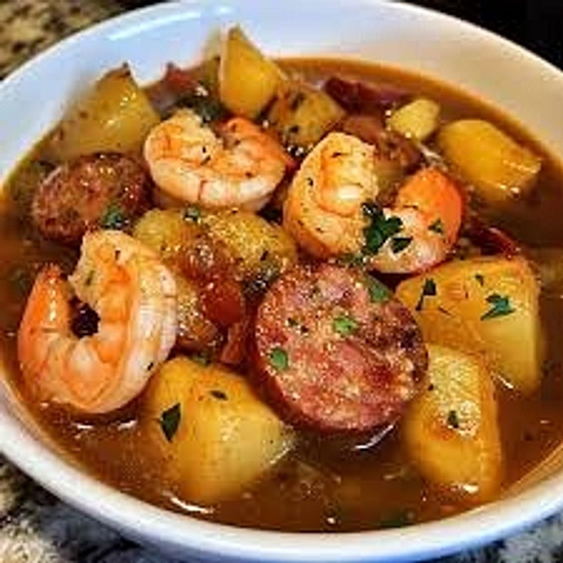 Smothered potatoes with shrimp, chicken and sausage