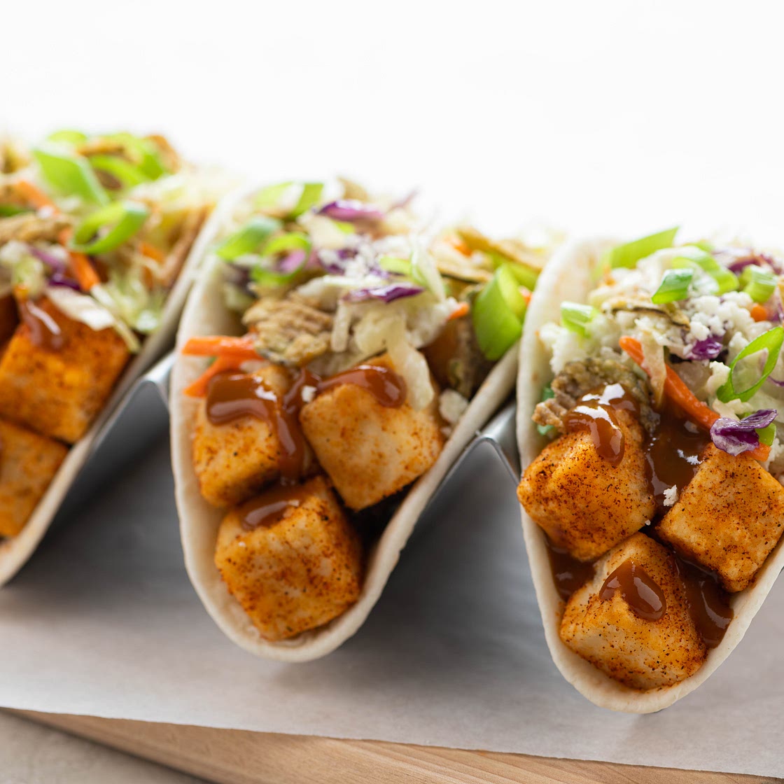 Crispy Carolina BBQ Tofu Tacos with green chili slaw and crispy jalapeños
