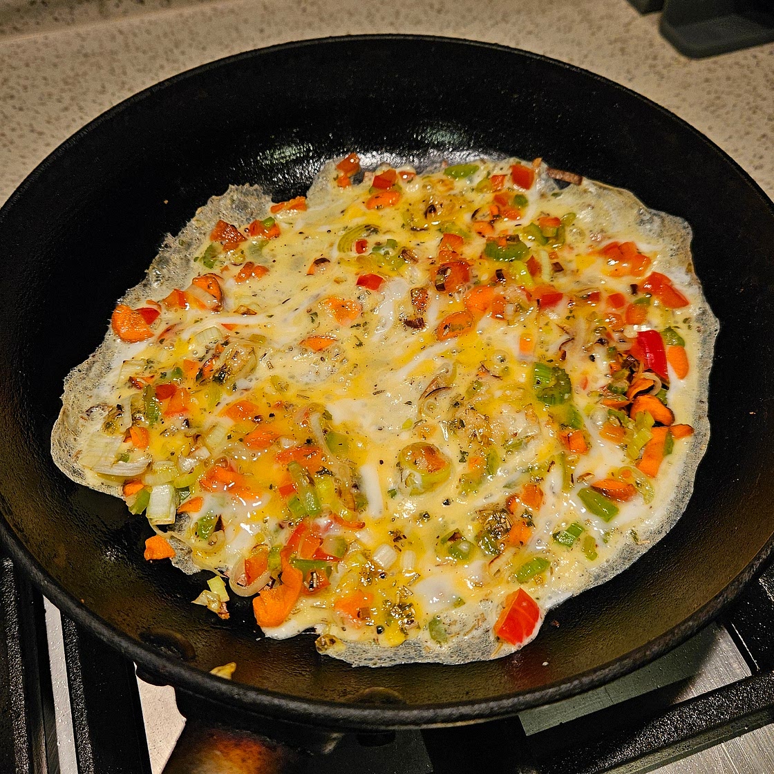 Omelette with carrot, celery, and capsicum