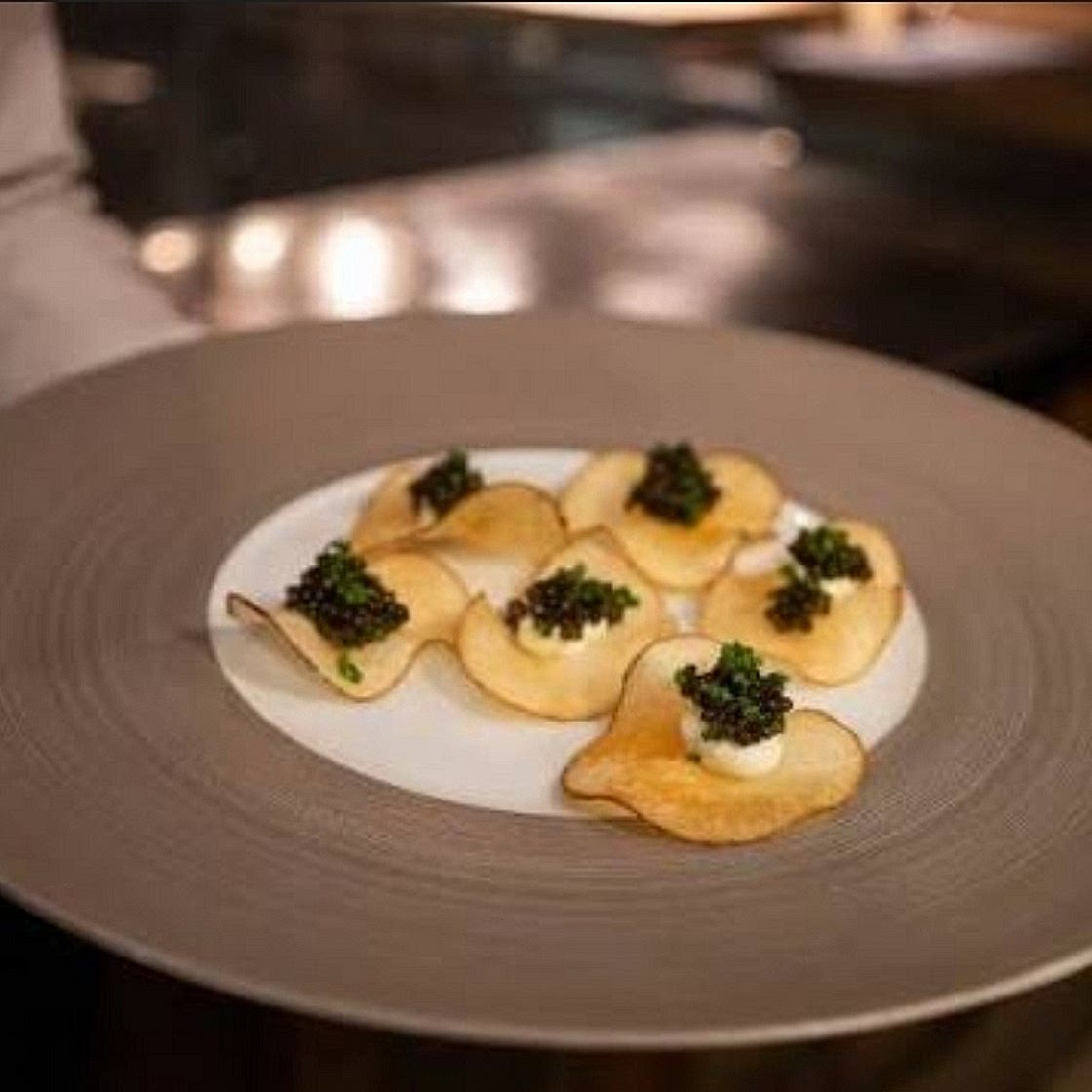 Caviar bite with craime fraîche and egg yolk and egg white