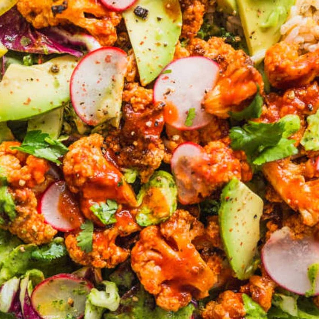 Recipe: Spicy Buffalo Cauliflower Bowls with Avocado and Green Tahini