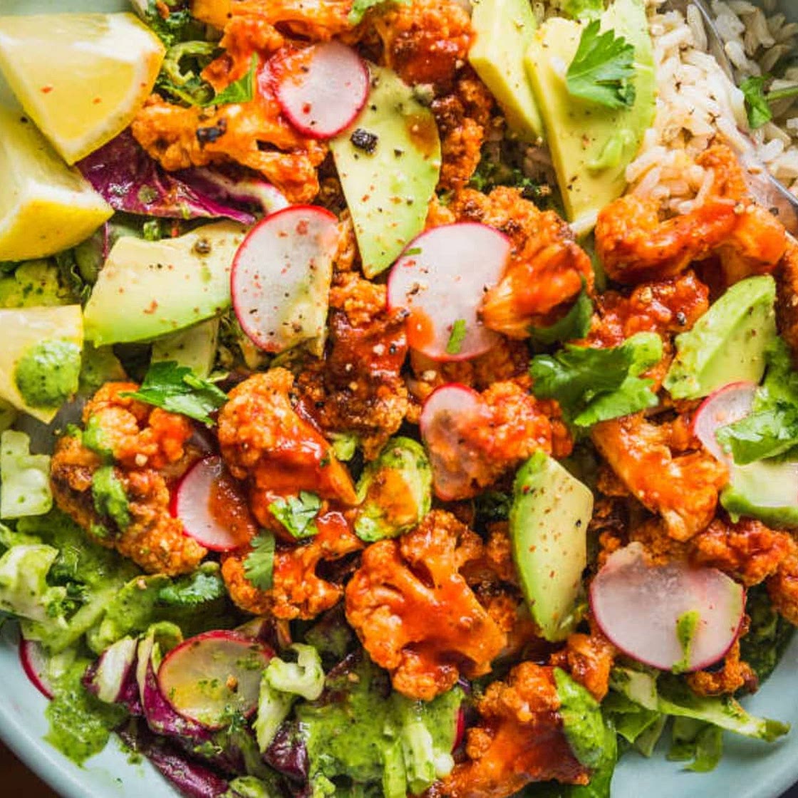 Recipe: Spicy Buffalo Cauliflower Bowls with Avocado and Green Tahini