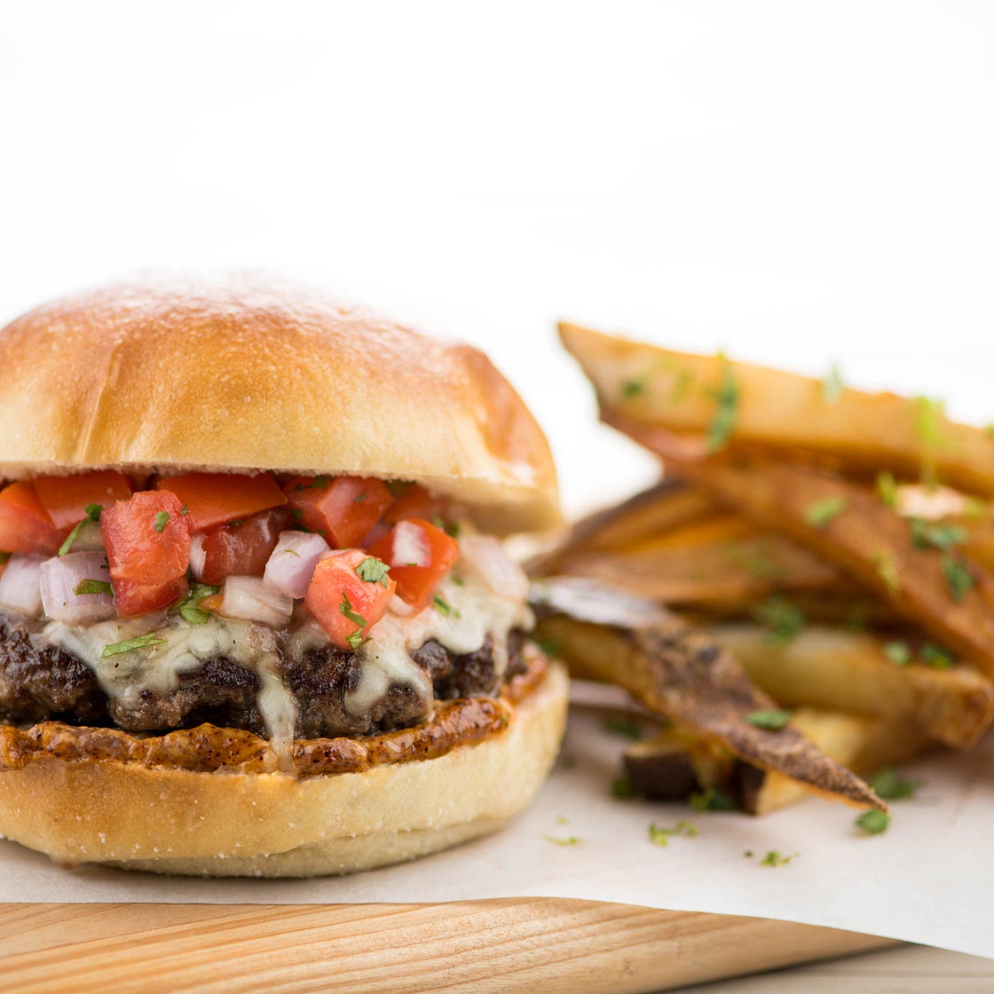 Acapulco Beef Burger with fresh pico de gallo and cilantro-lime fries