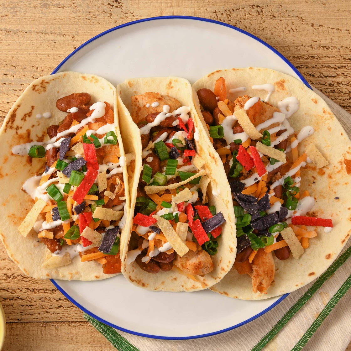 Chicken Chili Tacos with beans and sour cream