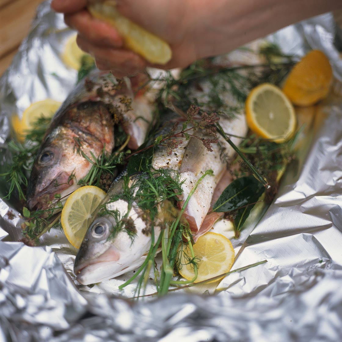 Whole sea bass baked in a bag & stuffed with herbs