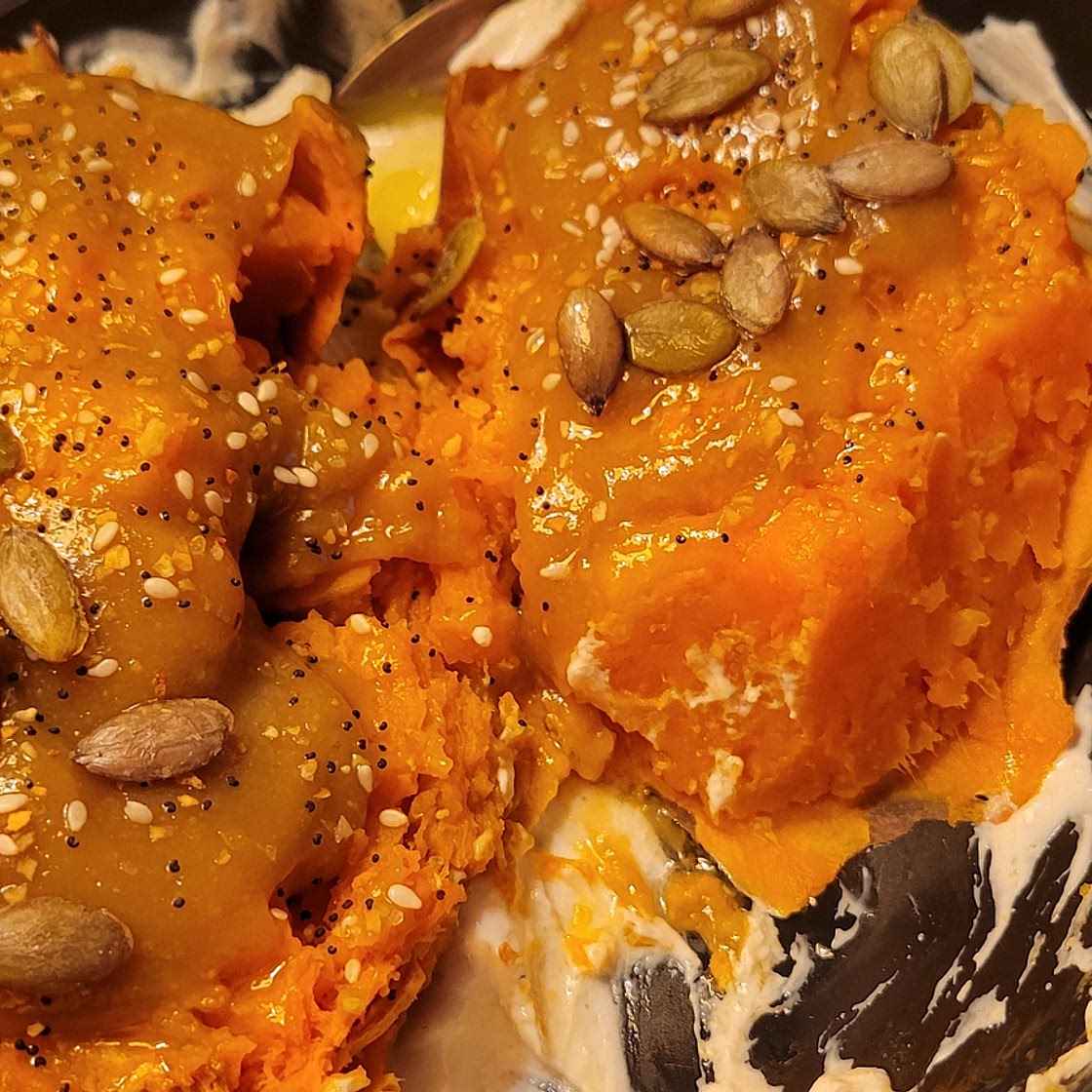Tahini topped sweet potato with garlic yogurt