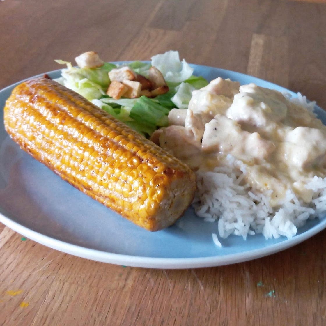 Parmesanhühnchen mit Reis und Mais